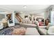 Stylish living room with hardwood floors, neutral color palette, and staircase view at 2246 Bluebell Way, Fort Mill, SC 29708