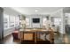 Spacious living room with hardwood floors, a large window, and elegant decor at 2246 Bluebell Way, Fort Mill, SC 29708