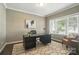 Bright office with a large window, sleek desk, comfortable chair, and modern decor for a productive workspace at 2246 Bluebell Way, Fort Mill, SC 29708