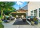 A relaxing patio area with comfortable seating and a large umbrella for shade at 2246 Bluebell Way, Fort Mill, SC 29708