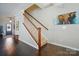Inviting staircase featuring wood and white detailing, hardwood floors, and a bright, welcoming entry at 2246 Bluebell Way, Fort Mill, SC 29708