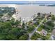 An aerial view of a waterfront property featuring a large lake, mature trees, and manicured lawns at 22501 John Gamble Rd, Cornelius, NC 28031