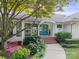 Inviting front entrance with double doors, brick steps, and well-manicured landscaping at 22501 John Gamble Rd, Cornelius, NC 28031