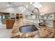 The kitchen features a stainless steel sink and a granite countertop at 22501 John Gamble Rd, Cornelius, NC 28031