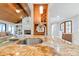 Stylish kitchen island with granite countertop, complemented by hardwood cabinetry and recessed lighting at 22501 John Gamble Rd, Cornelius, NC 28031