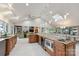 Expansive kitchen with stainless appliances, tile floor, granite countertops, and eat-in dining area at 22501 John Gamble Rd, Cornelius, NC 28031
