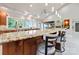 Bright kitchen features granite countertops, pendant lighting, and bar seating at 22501 John Gamble Rd, Cornelius, NC 28031