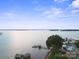 A panoramic lake view featuring a boat dock and waterfront homes at 22501 John Gamble Rd, Cornelius, NC 28031