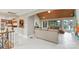 Open-concept living room and staircase with white tile floors at 22501 John Gamble Rd, Cornelius, NC 28031