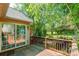 The back deck provides scenic outdoor relaxation, connecting to lush greenery via sliding glass doors at 2363 Sanderling Dr, Rock Hill, SC 29732