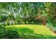 Beautiful backyard with lush green lawn and mature trees, perfect for outdoor activities and relaxation at 2363 Sanderling Dr, Rock Hill, SC 29732