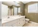 Bathroom features a double sink vanity, a large mirror, and a shower with glass doors at 2363 Sanderling Dr, Rock Hill, SC 29732