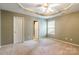 Spacious bedroom with a tray ceiling, ceiling fan, neutral walls and carpet at 2363 Sanderling Dr, Rock Hill, SC 29732