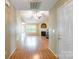 Inviting foyer featuring wood flooring, a view of the living room, and neutral color palette at 2363 Sanderling Dr, Rock Hill, SC 29732