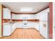 Bright kitchen with white cabinets, laminate countertops, and all-white appliances at 2363 Sanderling Dr, Rock Hill, SC 29732