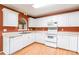 Clean kitchen featuring white cabinets, contrasting walls, laminate countertops, and matching appliances at 2363 Sanderling Dr, Rock Hill, SC 29732