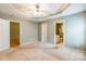 Large main bedroom with tray ceiling, ceiling fan, en-suite bathroom and walk-in closet at 2363 Sanderling Dr, Rock Hill, SC 29732