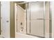 Bathroom features a shower with a showerhead and sliding glass doors at 2363 Sanderling Dr, Rock Hill, SC 29732