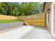 Backyard showcasing a concrete patio and a well-maintained wooden fence, creating a private outdoor space at 2413 Pruitt St, Charlotte, NC 28208