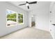Bright bedroom features a view of the backyard and an ensuite bathroom at 2413 Pruitt St, Charlotte, NC 28208