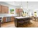 Bright kitchen with a large island, breakfast bar, stainless steel appliances, and ample natural light at 2413 Pruitt St, Charlotte, NC 28208