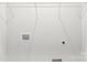 A well-lit laundry room with open shelving and modern utility hookups at 2413 Pruitt St, Charlotte, NC 28208