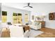 Inviting living room with stylish decor, natural light, backyard view, and comfortable seating arrangement at 2413 Pruitt St, Charlotte, NC 28208