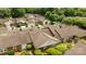 Aerial view of residential neighborhood with green trees, manicured yards, and brick homes with brown roofs at 2419 Quail Lake Dr, Charlotte, NC 28210
