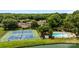 Aerial view of a community featuring tennis courts, a pool and mature trees at 2419 Quail Lake Dr, Charlotte, NC 28210