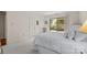 Bedroom featuring neutral carpet, white bedding, bright walls, and natural light at 2419 Quail Lake Dr, Charlotte, NC 28210