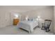 Spacious bedroom showcasing neutral carpet, white bedding, bright walls, and accent furniture at 2419 Quail Lake Dr, Charlotte, NC 28210