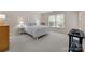 Bedroom with neutral carpet, white bedding, accent pillows, natural light, and bright walls at 2419 Quail Lake Dr, Charlotte, NC 28210