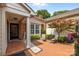 Charming courtyard with brick paving, seating area, and well-maintained landscaping, creating a welcoming outdoor space at 2419 Quail Lake Dr, Charlotte, NC 28210