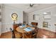 Cozy dining room with a round table, hardwood floors, and ample lighting, adjacent to the kitchen, ideal for Gathering meals at 2419 Quail Lake Dr, Charlotte, NC 28210