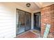 Welcoming entrance features a 'hello' mat, glass doors, and classic brick accents at 2419 Quail Lake Dr, Charlotte, NC 28210