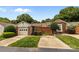 Well-maintained exterior featuring a one-car garage, brick accents, and lush landscaping, offering great curb appeal at 2419 Quail Lake Dr, Charlotte, NC 28210