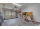 Clean garage with work bench, shelving, and ample space for storage and parking at 2419 Quail Lake Dr, Charlotte, NC 28210