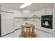 Functional kitchen with white cabinetry, essential appliances, and a center island, offering plenty of space for meal preparation at 2419 Quail Lake Dr, Charlotte, NC 28210