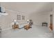 Inviting living room with neutral carpet, a fireplace, comfortable seating, and stylish decor for a cozy ambiance at 2419 Quail Lake Dr, Charlotte, NC 28210
