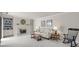 Cozy living room with a fireplace, plush carpeting, built-in shelving, and neutral decor for a comfortable atmosphere at 2419 Quail Lake Dr, Charlotte, NC 28210