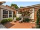 Patio seating area nestled amongst the landscaped yard at 2419 Quail Lake Dr, Charlotte, NC 28210