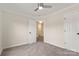 Bright bedroom featuring neutral carpet, a ceiling fan, and white trim at 2448 Sweet Birch Ct, Gastonia, NC 28054