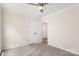 Bedroom featuring neutral carpet, white trim, and a ceiling fan at 2448 Sweet Birch Ct, Gastonia, NC 28054
