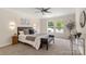 Calm bedroom with natural light, ceiling fan, and neutral decor at 2448 Sweet Birch Ct, Gastonia, NC 28054