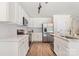 Contemporary eat-in kitchen features stainless appliances, white cabinets and granite counters at 2448 Sweet Birch Ct, Gastonia, NC 28054