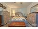 Bright bedroom with floral bedding, rustic wood furniture, a ceiling fan, and matching decor, offering a serene retreat at 2449 Leonhardt Rd, Cherryville, NC 28021