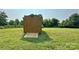 A well-maintained wooden shed with a ramp, nestled in a spacious yard at 2449 Leonhardt Rd, Cherryville, NC 28021