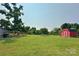 Wide shot of backyard showing shed, trees, and yard at 2449 Leonhardt Rd, Cherryville, NC 28021