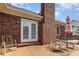 Charming back deck with outdoor seating, perfect for relaxing and enjoying the serene backyard view at 2627 Willis Dr, Harrisburg, NC 28075
