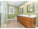 Bathroom with a dual vanity, tile flooring, and shower with glass door at 2627 Willis Dr, Harrisburg, NC 28075